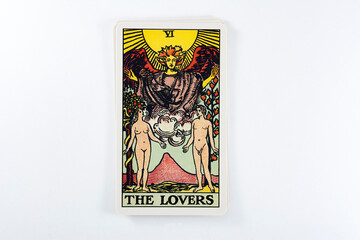 Naklejka na ściany i meble Tarot cards, Rider Waite tarot cards, the lovers vintage card in the foreground.