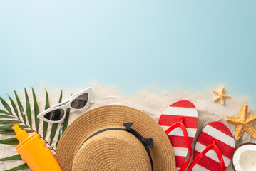 Tropical beach getaway theme. Overhead shot of beach essentials: sunglasses, sun hat, sandals, sunscreen, starfish, palm leaves, fresh coconut. Empty space for text or ad on sandy and ocean backdrop - obrazy, fototapety, plakaty