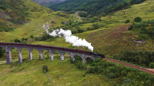 Jacobite steam train and the Glenfinnan Viaduct, in the Scottish highlands - Aerial view