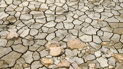 Close up of dry cracked earth on salt flats in Alykes, Greece with copy space, useful as a background