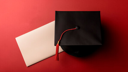 Graduation cap and blank paper with copy space on a red background. Education concept. Generative AI.