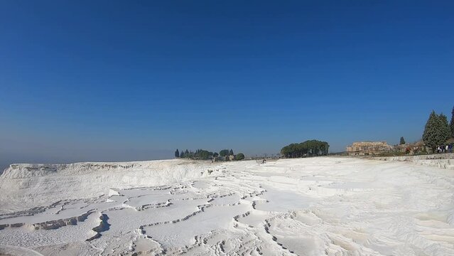 image of the magnificent natural area of Pamukkale. White rock and limestone formations that form from thermal waters