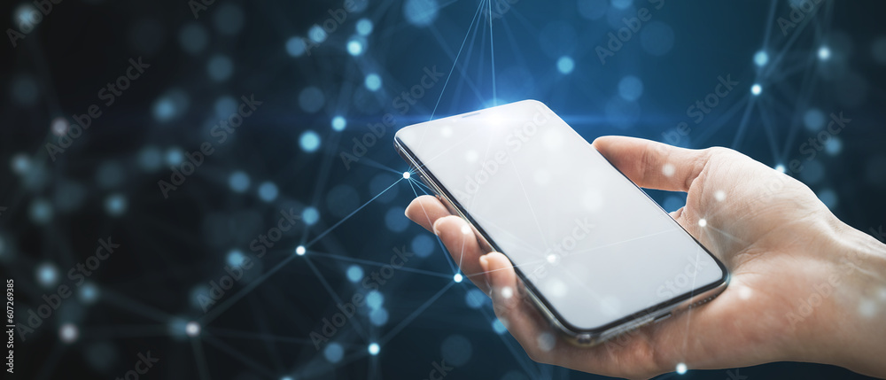 Poster close up of female hand holding white cellphone with creative glowing blurry plexus on dark backgrou