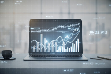 Close up of laptop computer at workplace with coffee cup and candlestick forex chart or graph on blurry window with city view background. Financial trade market and stock concept. 3D Rendering.