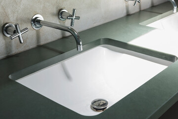 Faucet and sink in modern bathroom