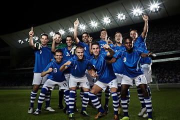 Soccer team cheering on field