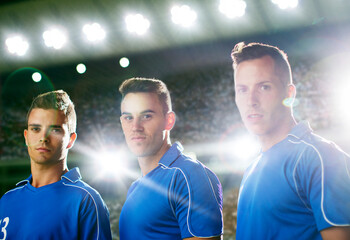 Soccer players standing on field