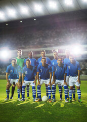 Soccer team posing on field © KOTO