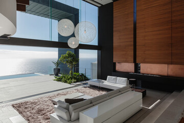 Living room in modern house overlooking ocean