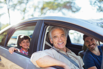 Portrait of multi-generation men inside car