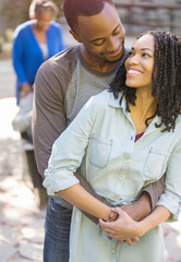 Obraz premium Happy couple hugging outdoors