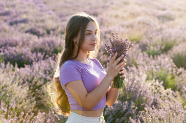 Beautiful young girl in a lavender provence at sunset nature. provence girl at lavender flowers. Adorable girl in lavender provence during summer holidays. Portrait of a girl in lavender provence