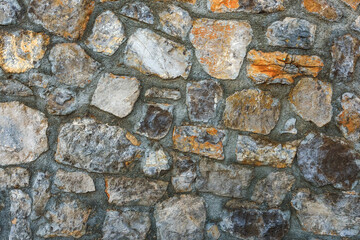 Old stone wall in croatian town of Opatija as background