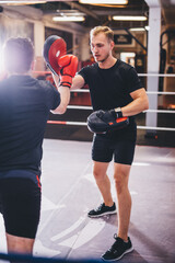Boxers do boxing training on a gym