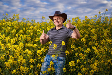 Farmer at canola plantation