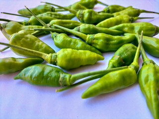 Selective focus. Green peppers or green cayenne pepper isolated on white.
