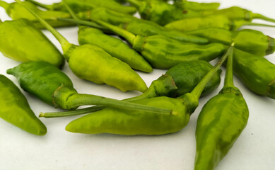 Selective focus. Green peppers or green cayenne pepper isolated on white.
