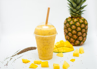 pineapple mango smoothie on a white background
