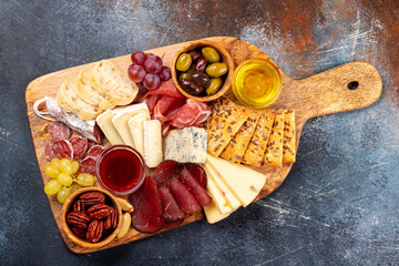 Antipasto board with prosciutto, salami, crackers, cheese