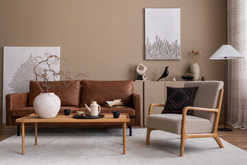 Interior design of cozy living room interior with mock up poster frame, brown sofa, gray armchair, wooden coffee table, beige carpet and personal accessories. Home decor. Template.