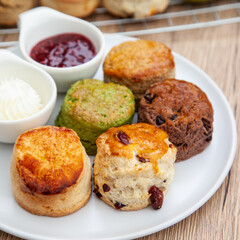 Five flavour of scone, chocolate, butter, cranberry, Earl grey, Matcha, served with clotted cream and raspberry jam. 