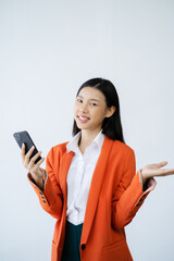 Fototapeta premium Portrait of Asian woman talking mobile phone to empty copy space isolated on white background.