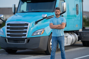 Men driver near lorry truck. Truck driver. Trucking owner. Transportation vehicles. Handsome man posing in front of truck. Semi trucks vehicle.