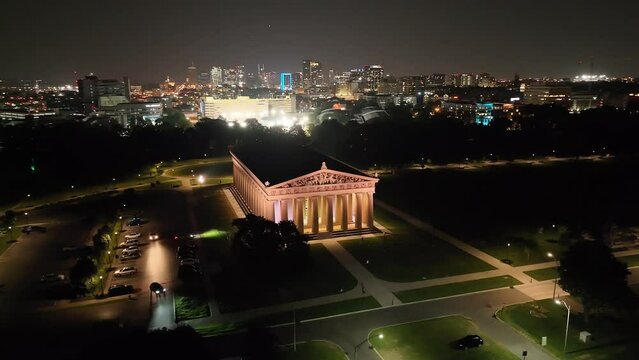 The Parthenon building at night in Nashville, Tennessee with drone video moving in a circle.