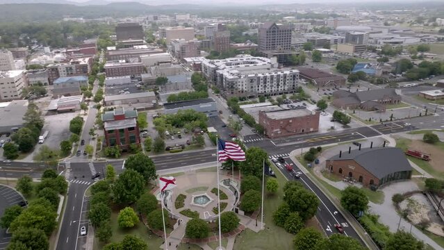 Huntsville, Alabama skyline with drone video moving in a circle with flags.