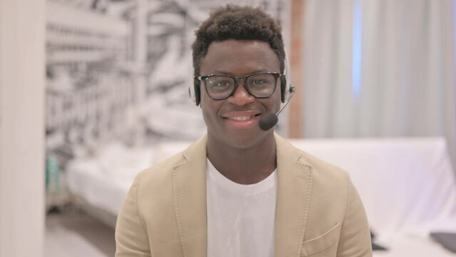 Thumbs Up By African American Man With Headset In Call Centre