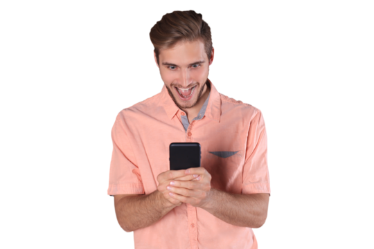 Shocked young man standing using mobile phone on a transparent background