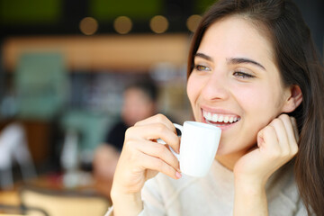 Fototapeta Happy woman drinking coffee and laughing obraz