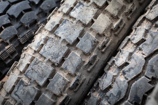 Old motorcycle tires. Dirty tire treads. Waste collection and recycling