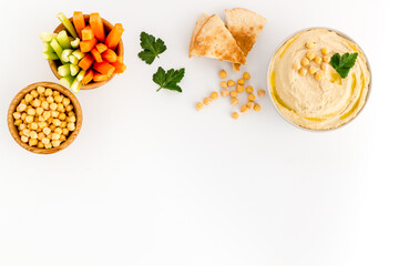 Chickpea hummus with vegetables sticks and pita croutons