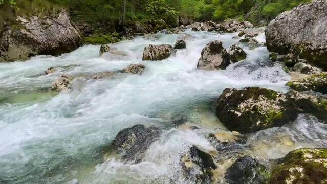 The flow of a mountain river in the stones