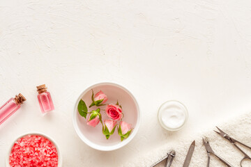 Manicure accessories with roses and towel. Beauty care salon spa.