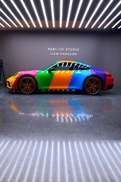 Bangkok, Thailand - May 26,2023 : Colorful Porsche 911 limited edition sports car with lighting on surface showing in Porsche showroom at Siam Paragon in vertical frame