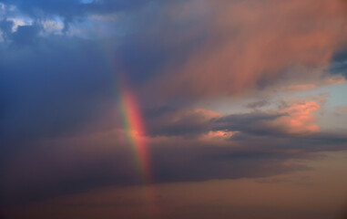 Naklejka na ściany i meble Natural colorful rainbow in clouds.