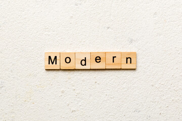 modern word written on wood block. modern text on cement table for your desing, concept