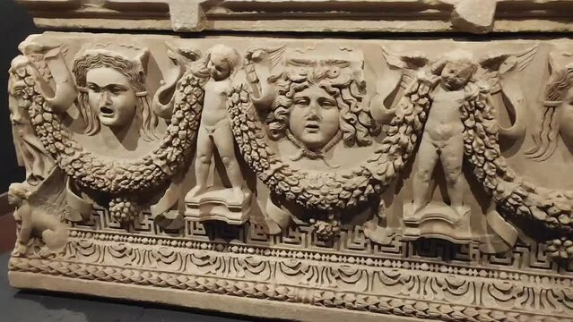 Antalya, Turkey, May 23, 2023. Ancient marble facades of ancient Roman tombs depicting people