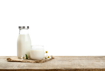 A bottle of milk and glass of milk on a wooden table with transparent background png, nutritious...
