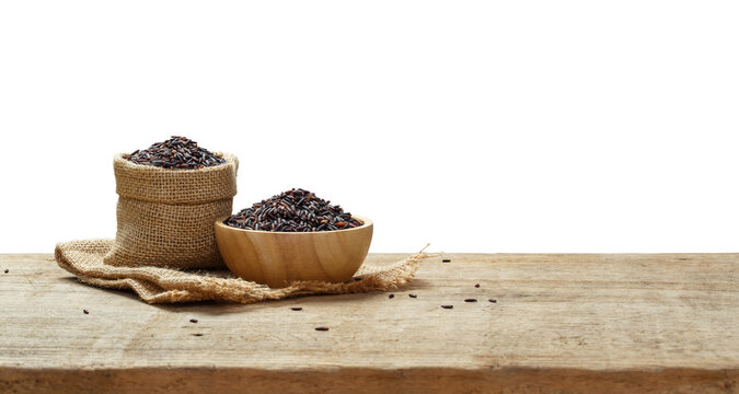 Riceberry in wooden bowl with the chopsticks on the wooden table with transparent background png