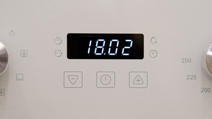 Timer clock on the kitchen oven. Cooking time, close-up