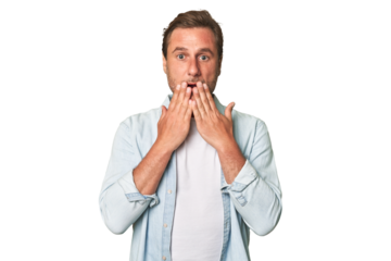 A middle-aged man isolated shocked, covering mouth with hands, anxious to discover something new.