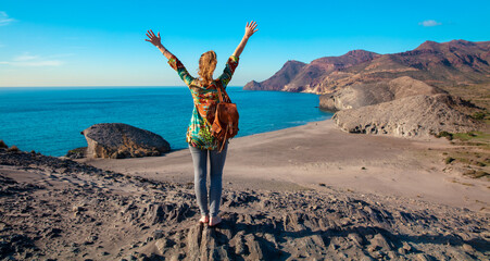 Happy woman tourist traveling in Spain-  beach in Andalusia