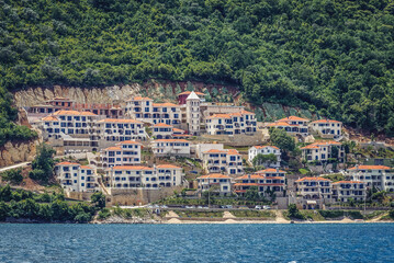 Apartment buildings in Kostanjica town in Kotor Bay, Montenegro