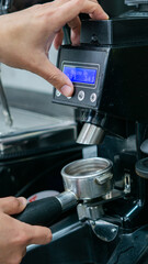 young barista worker preparing coffee in a colombian coffee shop