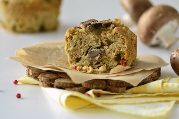 Muffin with mushrooms and cheese on cornmeal, snack muffin