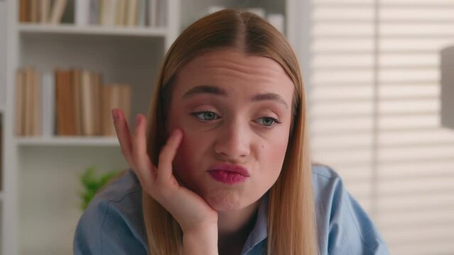 Close up sad dissatisfied confused bored female face portrait stress offended woman Caucasian displeased girl disappointed at office business work study problem failure boring annoyed grimace thinking