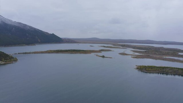 Aerial drone footage of Borovoe and Great Chebachye Lakes in Natonal park Burabay, Kazakhstan. The Blue Mountain - Kokshe Tau in winter landscape.